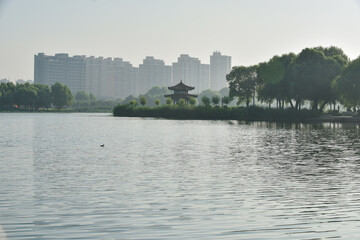 Hetang plank road and waterfront city skyline in urban park