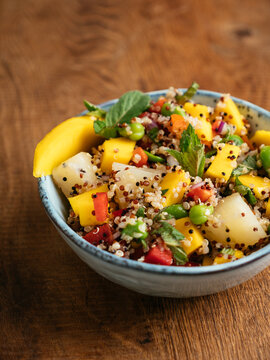 Tropical quinoa salad with mango, pineapple and fava beans.