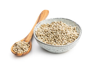 Whole pepper spice. White peppercorn grain in bowl