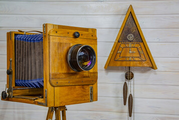 Vintage wooden clock and retro camera