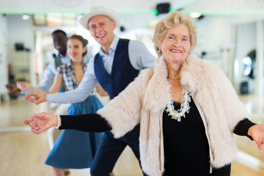 Jazz dancers standing in row and flicking with fingers