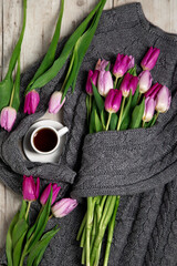 Warm sweater with tulips and coffee