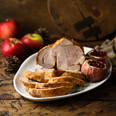 Homemade roasted pork with apples and cranberry