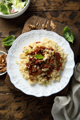 Homemade couscous with sun dried tomatoes and walnut