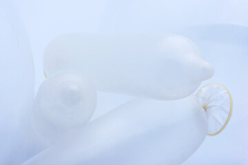Condoms in white