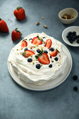 Pavlova meringue dessert with fresh berries