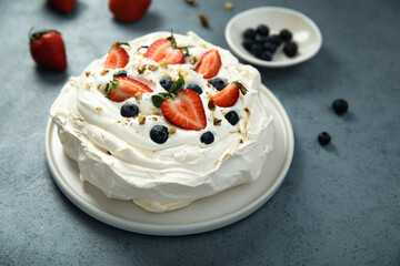 Pavlova meringue dessert with fresh berries