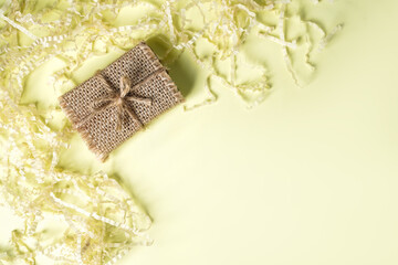 small craft gift box on light yellow background