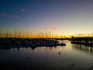 Obraz premium The Mediterranean Sea. Sea marina for yachts in the evening, the sun sets.