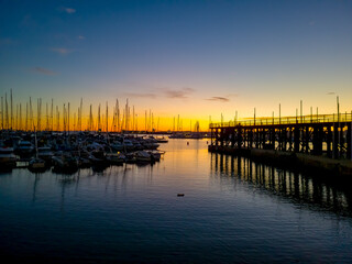 Obraz premium The Mediterranean Sea. Sea marina for yachts in the evening, the sun sets.
