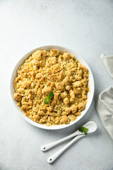 Traditional homemade crumble dessert with fresh mint