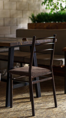 interior photography.  close-up chair stands near the table in the restaurant.  behind you can see a partition with green grass