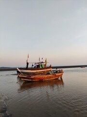 Naklejka na ściany i meble fishing boats at sunset