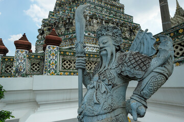 Bangkok, Thailand - January 2022: Detail of the Buddhist temple Wat Arun located on the banks of the Chao Phraya River on January 16, 2022 in Bangkok, Thailand.