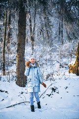 Woman happy walking in a winter park