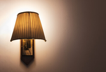 Vintage lamp on bedroom wall at night. with copy space