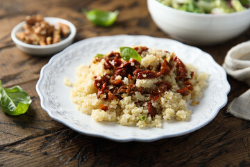 Homemade couscous with sun dried tomatoes and walnut