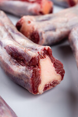 raw beef tails on a light background close-up