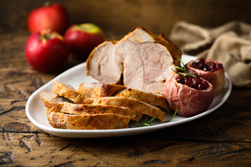 Homemade roasted pork with apples and cranberry