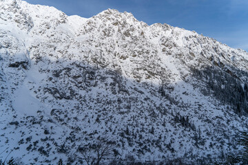 Mountain winter landscape in the Tatras, mountain view covered with snow in frosty sunny weather