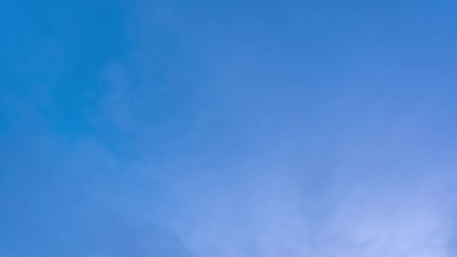 Beautiful sunny gradient morning sunrise blue sky with moving soft white clouds 4k stock video time lapse. Amazing natural landscape background