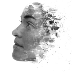 Paintography. A portrait of a young woman combined with black ink splashes.