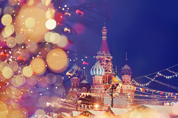 St. Basil Cathedral on Red Square in Moscow, bokeh christmas light of lanterns on winter night