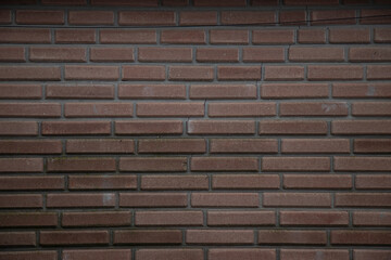Obraz premium Brick wall background. A wall with red long bricks.A wall with long bricks.