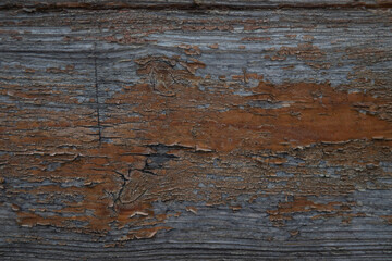 Wood with old varnish. Falling off varnish. Old wood material.