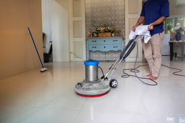 A worker man  cleaning and floor care by washing machine. in room at home image