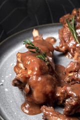 Traditional rabbit meat stew with red wine sauce