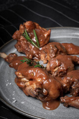 Traditional rabbit meat stew with red wine sauce