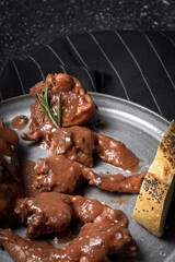 Traditional rabbit meat stew with red wine sauce