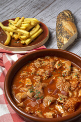 Traditional homemade and typical tripe recipe Madrid style with bread and French fries