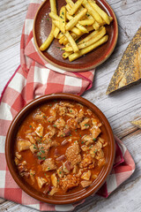 Traditional homemade and typical tripe recipe Madrid style with bread and French fries