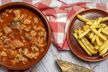 Traditional homemade and typical tripe recipe Madrid style with bread and French fries