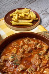 Traditional homemade and typical tripe recipe Madrid style with bread and French fries