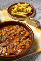 Traditional homemade and typical tripe recipe Madrid style with bread and French fries