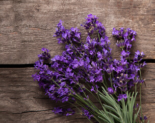 Bouquet of summer lavender on an old wooden background (top view)