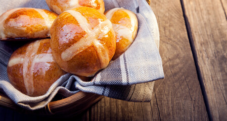 Hot cross buns on basket Top view, copy space. Easter baking