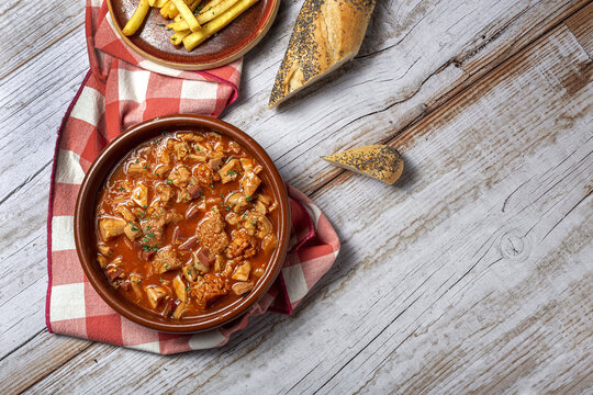 Traditional homemade and typical tripe recipe Madrid style with bread and French fries