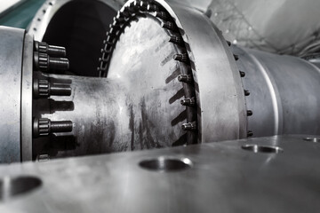 The rotor of a gas turbine compressor with a bolted coupling half