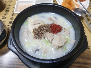 This is Korean food, Sundae Guk. This is a hot soup dish with pork. It tastes very good when eaten together with this and rice.