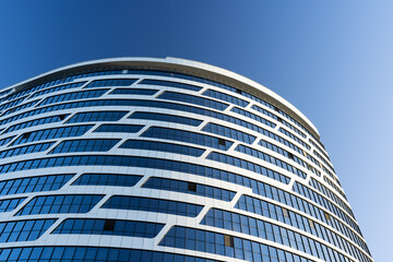 part of a semicircular building with beautiful windows. modern architecture. 