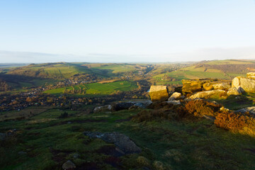 Rising winter sun begins to light up the Derbyshire landscape.