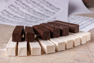 piano keyboard made of white and chocolate marshmallow, selective focus