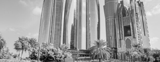 Buildings and skyscrapers of Abi Dhabi along Corniche Road on a sunny day, UAE.