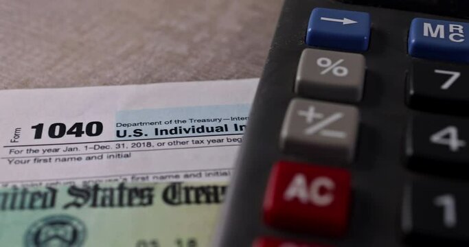 IRS form 1040 with individual income tax return of accountant is calculating company of Stimulus economic tax return check