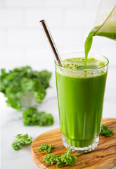 Green vegetable juice with pour; copy space