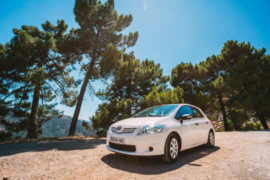 White color Toyota Auris car on Spain nature landscape
